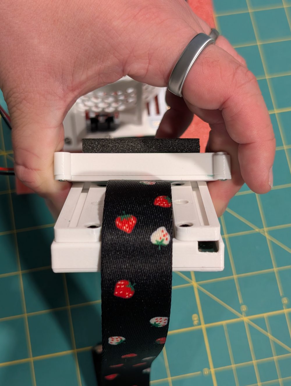 Sliding the battery pack onto the compute pack's rails over the strap